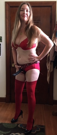 front view of red corset strapon